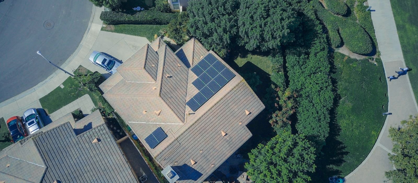 Aerial view of a residential neighbourhood with rooftop solar panels